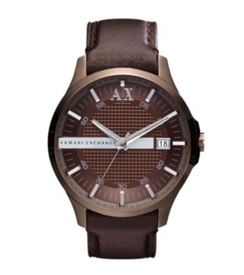 Rich chocolate colored construction highlighted with silvertone details lends a unique charm to this leather and stainless steel watch.