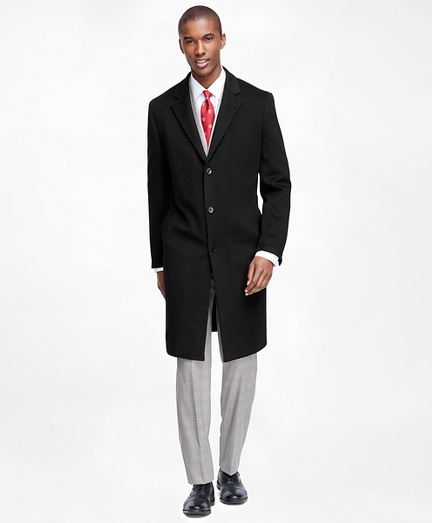 All-weather pure Italian wool from                 Loro Piana� is treated to resist water and wind, yet it retains its luxurious texture and drape. Impeccably tailored for an elegant fit. Long town coat with 3-button front. 45" long. Genuine corozo buttons, high lapels and slash pockets. Dry clean. Made in Italy.