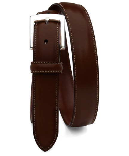 Calfskin. Silver-tone buckle. Leather lined. Contrast stitching. 1 1/4" width. Made in Italy.