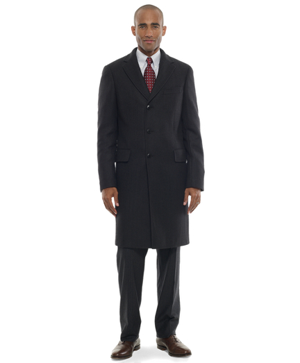 Luxurious Saxxon wool woven in Italy. Regent fi t. 39" center back length. Dry clean. Imported.