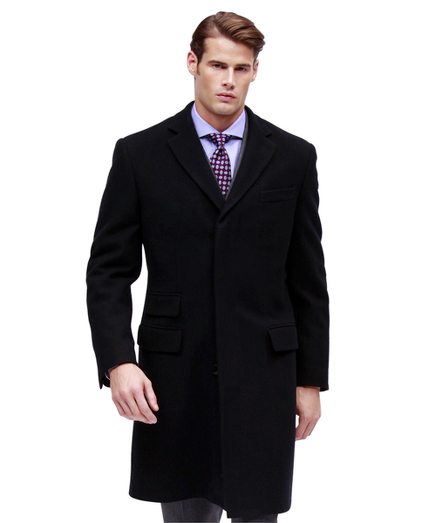 Pure wool in a classic herringbone pattern. Fully lined. 44" center back length. Dry clean. Imported.