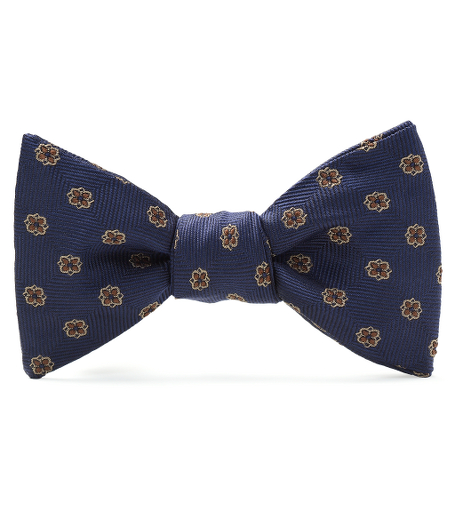 Pure silk woven in Italy. Self-tie bow. Dry clean. Made in the USA.