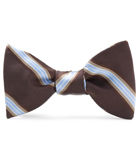 Pure silk woven in Italy. Self-tie bow. Dry clean. Made in the USA.