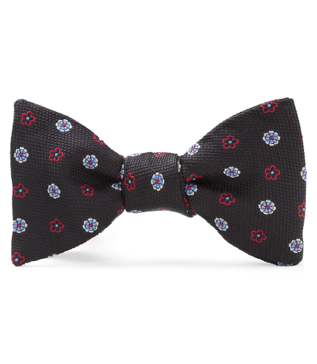 Pure silk woven in England. Self-tie bow. Dry clean. Made in the USA.