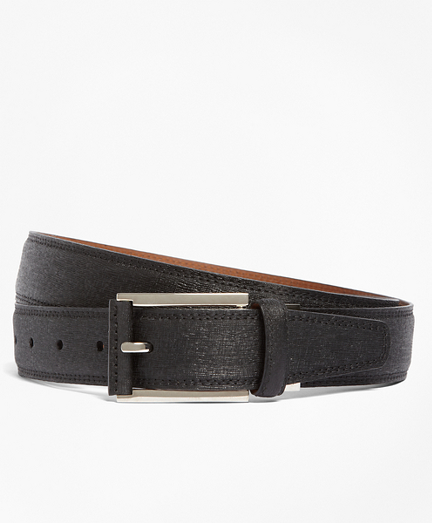 Genuine calfskin Saffiano leather with a subtle texture. Crafted in Italy. Stitched edges. Leather backing. Silver-tone buckle. 1 1/4' wide. Imported.