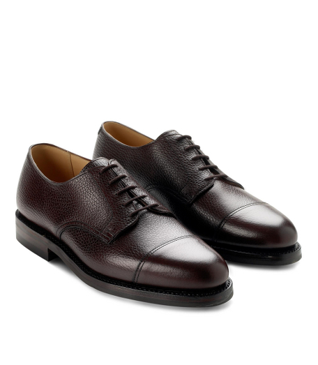 The pebbled texture of Scotch grain calfskin recalls the elegance of a bygone era. Leather lined. Dainite rubber sole with genuine Goodyear welt construction. Made in England.