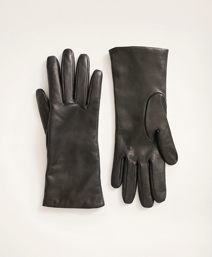 Soft lambskin gloves are lined with cashmere. Made in Italy.