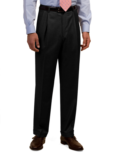 Tailored in refined wool gabardine. Reverse double-pleat front. On-seam pockets. Lined to the knee. Unfinished hems. Dry clean. Imported.