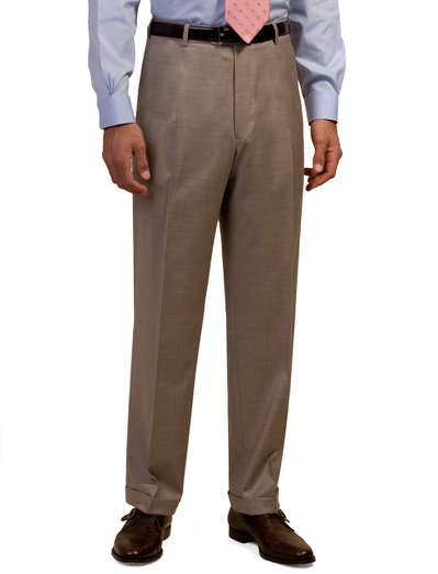 Tailored in refined wool gabardine. Plain front. On-seam pockets. Lined to the knee. Unfinished hems. Dry clean. Imported.