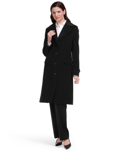 Loro Piana wool. Corozo buttons. Fully lined in Bemberg. Front flap pockets. Dry clean. Imported.
