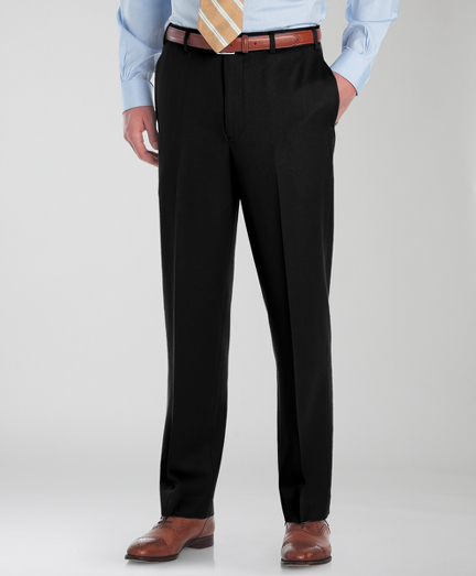 Tailored in pure worsted wool. On-seam pockets. Lined to the knee. Finished hem. Dry clean. Imported.