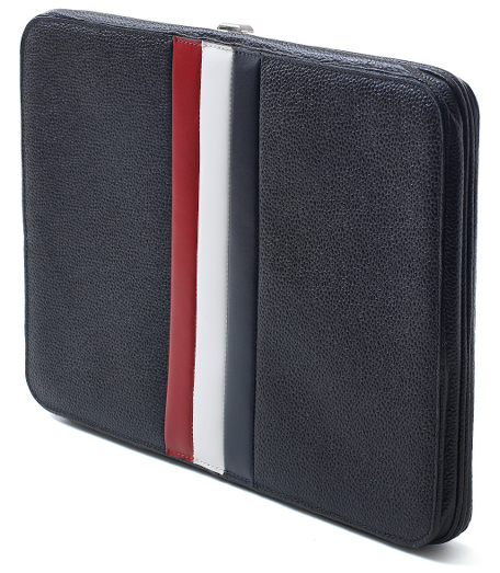 Genuine pebble grain leather with a red,white and navy stripe. 14" x 10". Imported.