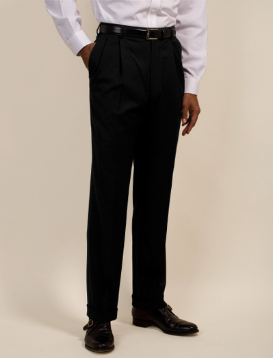 Made with a blend of wool and  DOW XLA fiber for  stretch. Regent fit. Lined to the knee. Unfinished hem. Dry clean. Imported.