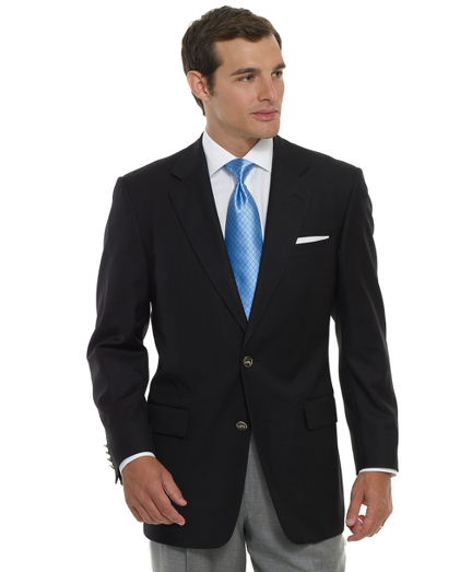 An elegant look in pure lightweight wool. Classically detailed with double besom pockets and a back center vent. Darted and slightly fitted through the chest. Full signature navy lining wtih green trim. Dry clean. Made in the USA.
