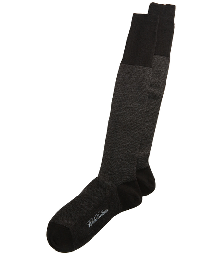 Wool and nylon blend.  Handlinked toes for extra comport.  Extended cuff length.  Sized for perfectfit.  Machine was warm, line dry.  Do not bleach.   Made in Italy.