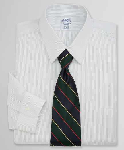 Pure cotton broadcloth. Pucker-free seams and treated to remain virtually wrinkle-free. Forward point collar. Center back pleat. Signature shirring at barrel cuffs. Machine wash. Imported. Also available in Traditional fit.