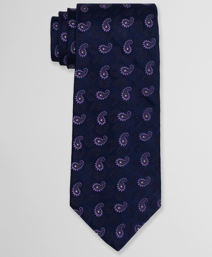 Pure silk woven in England. 4" width. Self-loop and tip. Dry clean. Made in the USA.