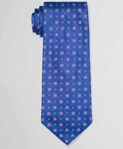 Pure silk woven in Italy. 4" width. Self-loop and tip. Dry clean. Made in the USA.