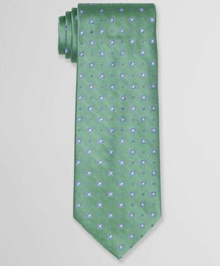 Pure silk woven in Italy. 4" width. Self-loop and tip. Dry clean. Made in the USA.