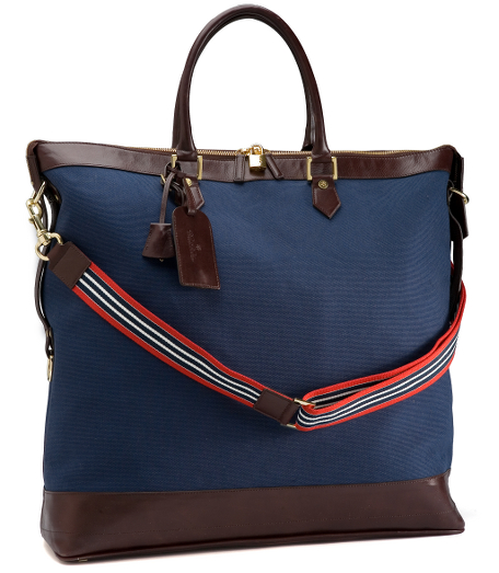 Durable cotton canvas bags with web stripe detai ls and leather trim. Brass hardware. Roomy bag with zip top and outside zipper pocket. Shoulder strap. Luggage tag. 20" x 13 1/2" x 7".