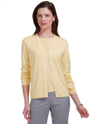 Silk/cotton. V-neck. Mother-of-pearl buttons. Tipping at neck and down front placket. Ribbing at cuff and hem. Hand wash or dry clean. Imported.