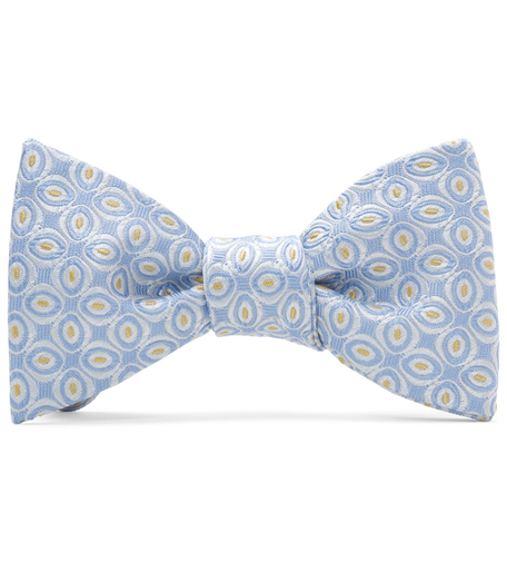 Pure silk woven in Italy. Dry clean. Made in the USA. Self-tie bow.