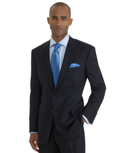 Hand-tailored in elegant wool and cashmere blend. Distinguished by impeccable workmanship and near bespoke details. 2-button, center vent. Double-reverse pleat trousers. Dry clean. Hand tailored in the USA.