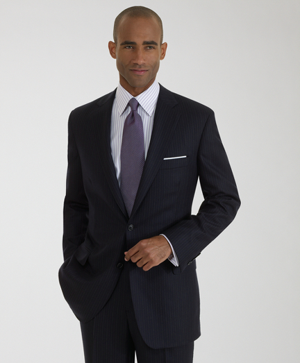 Hand-tailored in elegant wool woven in England. Distiguished by impeccable workmanship and near bespoke details. 2-button, center vent with pickstitch. Plain front trousers. Dry clean. Hand tailored in the USA.