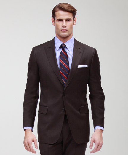 A contemporary take on the classic Brooks Brothers suit. Tailored from elegant wool woven in Italy.Updated with slimmer lines, a narrower lapel with pickstitch detail and trimmer trousers. Fully lined. 2-button jacket with side vent and peak lapel. Plain-front trousers. Made in Italy. Dry clean.