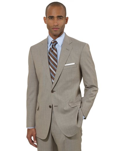 A contemporary take on the classic Brooks Brothers suit. Tailored from elegant Saxxon wool woven in the USA. Updated with slimmer lines, a narrower lapel with pickstitch detail and trimmer trousers. Fully lined. Two-button jacket with center vent. Plain-front trousers. Dry clean. Made in the USA.