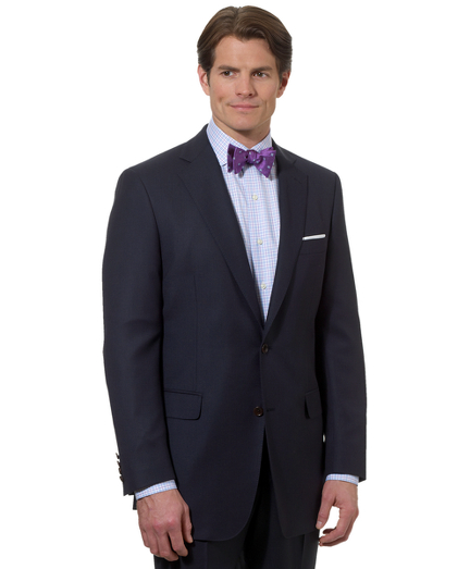 A contemporary take on the classic Brooks Brothers suit, tailored from elegant wool woven in Italy. Updated with slimmer lines, a narrower lapel with pickstitch detail and trimmer trousers. Fully lined. Two-button, side vents. Plain-front trousers. Dry clean only. Made in Italy.