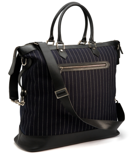 Durable acrylic fabric with calfskin accents. Silver-toned hardware. 20" x 25" x 8. Shoulder strap and handle. Imported.