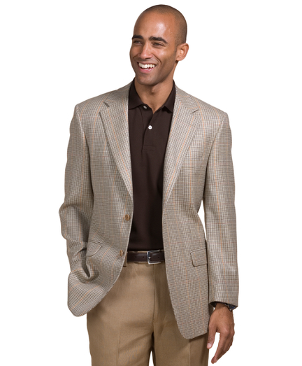 Pure wool. Two-button, center vent. 100% Bemberg lining. Sport coat comes with unfinished sleeves and unattached buttons that can be made functional. Dry clean. Made in Italy.