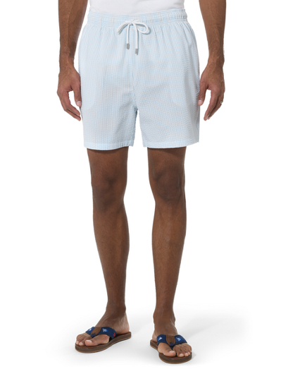 Cotton and nylon with mesh lining and drawstring elastic waist. Hidden key pocket at inside of swimsuit. Velcro back pocket for secure storage. Available in our classic Southampton fit with a 5" inseam. Machine wash. Imported.