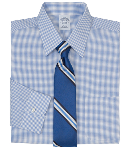 Pure cotton broadcloth made with pucker-free seams and specially treated to remain virtually wrinkle-free. Forward point collar. Signature shirring at barrel cuffs. Center back pleat. Left chest pocket. Machine wash. Imported. Also available in Traditional fit.