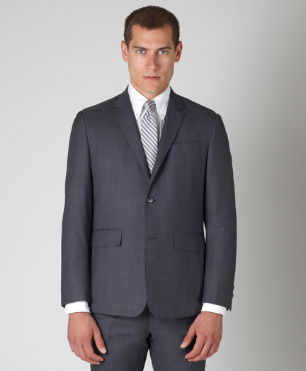 Pure wool twill.  3-button, double back vent. Genuine horn buttons. Jacket sleeves are unfinished. Signature cuff is 2-button holes. Full canvas construction. Locker loop at back neck. Jacket is lined in signature stripe lining of cotton and modal blend. Trousers are zip-fly and lined in 100% Bemberg signature stripe lining. Unfinished hem. Can be finished as seen or with a cuff and no break. Dry clean only. Made in the USA.