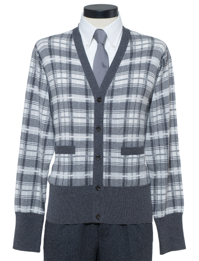 Pure handknit Scottish cashmere. Mother-of-pearl buttons. Button cuff with grosgrain on sleeve. Locker loop at back neck. Dry clean. Made in Scotland.
