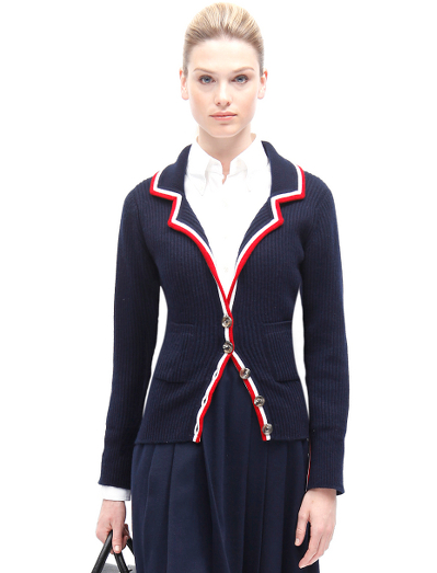 Pure Scottish cashmere. Mother-of-pearl buttons. Button cuff with grosgrain on sleeve and placket. Locker loop at back neck. Dry clean. Imported.