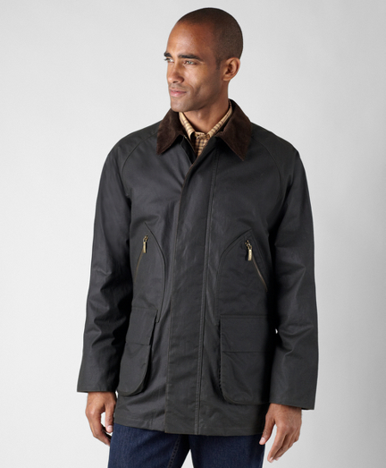 Genuine oilcloth gamekeeper jacket. Corduroy collar. Brooks Brothers signature tattersall lining. 100% cotton. Comes with a tin of oilcloth wax to extend and enhance water resistance. To clean, brush off soil, sponge fabric with cold water and hang dry. Imported.