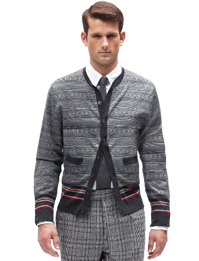 Pure merino wool. Mother-of-pearl buttons. Button cuff with grosgrain on sleeve and placket. Locker loop at back neck. Dry clean. Imported.