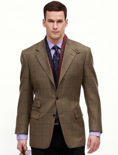 Worsted Shetland wool woven in England. 3-button, side vent. Throat latch and ticket pocket. Dry clean. Imported.