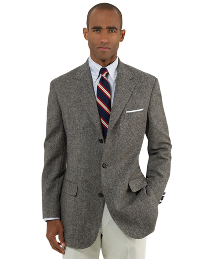 A classic Brooks Brothers sport coat woven in pure lambswool from England. 3-button, side vent, Madison fit. Leather wrapped buttons. Dry clean. Imported.