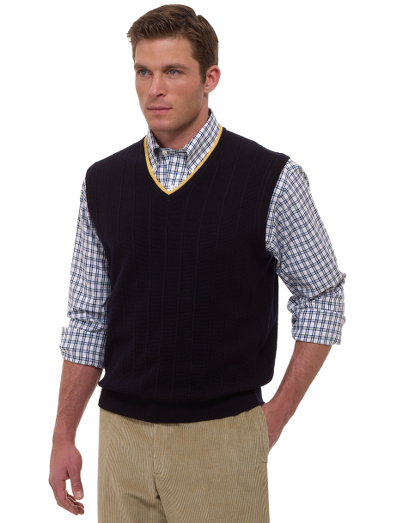 Extrafine Italian merino.  Classic vest body with an updated cable pattern. Contrast tipping for added detail. Fully fashioned. Dry clean. Imported.