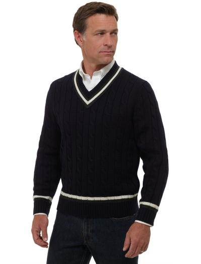 Extrafine Italian merino.  A variation of the classic v-neck tennis sweater. Fully fashioned. Dry clean. Imported.
