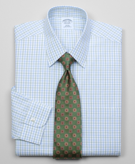 Pure cotton broadcloth made with pucker-free seams and specially treated to remain virtually wrinkle-free. Forward point collar. Signature shirring at barrel cuffs. Center back pleat. Left chest pocket. Machine wash. Imported. Also available in Traditional fit.