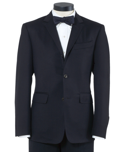 Pure wool twill. 3-button jacket with double back vent and silk faille on lapel. Signature stripe lining in a cotton and modal blend. Silk faille covered buttons. Locker loop at back of neck. Full canvas construction. Locker loop at back neck. Dry clean. Made in the USA.