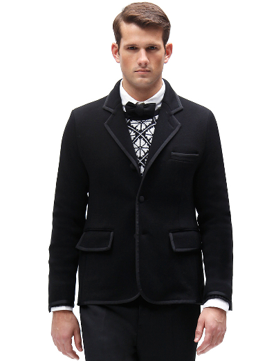 Pure merino wool. Black grosgrain trim and covered buttons.  Button cuff with grosgrain on sleeve and placket. Locker loop at back neck. Dry clean. Imported.