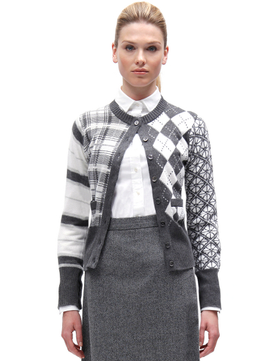 Pure Scottish cashmere. Mother-of-pearl buttons. Button cuff with grosgrain on sleeve and placket. Locker loop at back neck. Dry clean. Imported.
