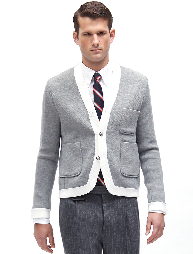 Pure merino wool. Silver Black Fleece logo buttons with white enamel. Button cuff with grosgrain on sleeve. Locker loop at back neck. Dry clean. Imported.