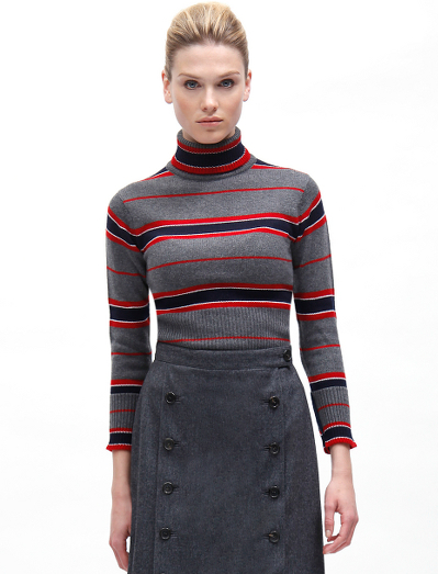 Pure Scottish cashmere. Button cuff with grosgrain on sleeve. Mother-of-pearl buttons. Locker loop at back neck. Dry clean. Imported.